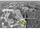 Highlighted lot lines showcase a property surrounded by greenery in a neighborhood setting in grayscale at 692 S Pink St, Cherryville, NC 28021