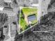 Aerial view of a property with highlighted lot lines, accented by lush trees, in a serene neighborhood setting at 692 S Pink St, Cherryville, NC 28021