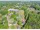 Aerial view showcases a home near Cherryville's downtown area, surrounded by lush greenery and neighborhood charm at 692 S Pink St, Cherryville, NC 28021
