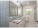 Updated bathroom with double vanity, granite countertops and modern mirrors at 692 S Pink St, Cherryville, NC 28021