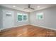 Bright, modern bedroom with hardwood floors, a ceiling fan, and two windows offering natural light at 692 S Pink St, Cherryville, NC 28021