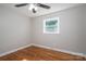 Bright bedroom featuring hardwood floors, ceiling fan and a window at 692 S Pink St, Cherryville, NC 28021
