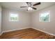 This bedroom features hardwood floors and has two nice bright windows at 692 S Pink St, Cherryville, NC 28021