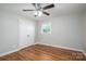 Bedroom with hardwood floors, closet and ceiling fan with light fixture at 692 S Pink St, Cherryville, NC 28021