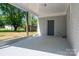 Spacious covered patio with painted brick and a backyard view provides a cozy outdoor space at 692 S Pink St, Cherryville, NC 28021