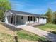 Charming one-story home with attached carport and neutral paint, inviting curb appeal and a grassy lawn at 692 S Pink St, Cherryville, NC 28021