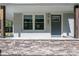 Close up view of the front door, stone accent and modern exterior details at 692 S Pink St, Cherryville, NC 28021