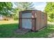 Exterior view of backyard shed with ramp in a green lawn at 692 S Pink St, Cherryville, NC 28021