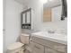 Cozy bathroom with modern vanity and gray accent cabinet at 8412 Cricket Lake Dr, Charlotte, NC 28277