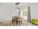 Dining area features modern light fixture and sliding glass doors to patio at 8412 Cricket Lake Dr, Charlotte, NC 28277