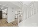 Bright entryway with staircase and views of the kitchen and dining areas at 8412 Cricket Lake Dr, Charlotte, NC 28277