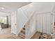 Well-lit entryway with staircase and wood-look floors at 8412 Cricket Lake Dr, Charlotte, NC 28277