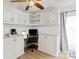Bright kitchen with built-in desk and stainless steel refrigerator at 8412 Cricket Lake Dr, Charlotte, NC 28277