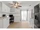 Spacious kitchen with built-in desk and sliding glass doors at 8412 Cricket Lake Dr, Charlotte, NC 28277