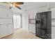 Bright kitchen with stainless steel refrigerator and white cabinets at 8412 Cricket Lake Dr, Charlotte, NC 28277