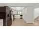 Modern eat-in kitchen with stainless steel appliances and white cabinetry at 8412 Cricket Lake Dr, Charlotte, NC 28277