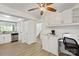 Bright eat-in kitchen boasts white cabinetry, desk area and stainless steel dishwasher at 8412 Cricket Lake Dr, Charlotte, NC 28277