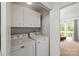 Functional laundry room equipped with washer and dryer, and access to outdoor space at 8412 Cricket Lake Dr, Charlotte, NC 28277