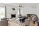 Cozy living room features fireplace, shiplap accent wall and large windows at 8412 Cricket Lake Dr, Charlotte, NC 28277