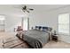 Bright main bedroom featuring a ceiling fan, natural light, and access to the home's rear deck at 8412 Cricket Lake Dr, Charlotte, NC 28277