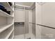 Spacious walk-in closet with shelving and ample storage space for clothes and accessories at 8412 Cricket Lake Dr, Charlotte, NC 28277