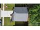 Aerial view of a house, showcasing its driveway, lush green lawn, and a durable roof with a satellite dish at 8829 Michaw Ct, Charlotte, NC 28269