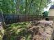 Backyard with a wood fence bordering the property and plenty of sunlight at 8829 Michaw Ct, Charlotte, NC 28269