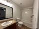 Bathroom with a tub-shower combo and a vanity at 8829 Michaw Ct, Charlotte, NC 28269
