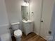Neat bathroom featuring a white vanity and toilet at 8829 Michaw Ct, Charlotte, NC 28269