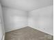 Minimalist bedroom provides ample space, carpeting and natural light at 8829 Michaw Ct, Charlotte, NC 28269
