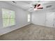 Neutral bedroom features large windows and neutral carpeting at 8829 Michaw Ct, Charlotte, NC 28269