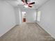Simple, carpeted bedroom with an ensuite bathroom and natural light at 8829 Michaw Ct, Charlotte, NC 28269