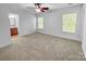 Bright bedroom with neutral carpet and two windows providing ample natural light at 8829 Michaw Ct, Charlotte, NC 28269