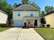 Charming two-story home with a well-manicured lawn and an attached garage at 8829 Michaw Ct, Charlotte, NC 28269