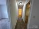 Hallway with carpet flooring leading to a bedroom and bathroom at 8829 Michaw Ct, Charlotte, NC 28269