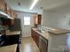 Efficient kitchen with stainless steel appliances and ample cabinetry at 8829 Michaw Ct, Charlotte, NC 28269