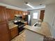 Cozy kitchen with stainless steel appliances and wood cabinetry at 8829 Michaw Ct, Charlotte, NC 28269