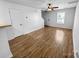 Bright living room with wood flooring, neutral walls, and ceiling fan at 8829 Michaw Ct, Charlotte, NC 28269