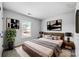 Comfortable main bedroom with a decorative headboard and warm, neutral tones at 8829 Michaw Ct, Charlotte, NC 28269