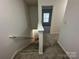 Staircase with neutral carpet leading to the upper level at 8829 Michaw Ct, Charlotte, NC 28269