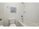 This bathroom features a tub and a toilet at 8923 Happiness Rd, Harrisburg, NC 28075