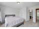 This bedroom features a closet and an attached bathroom for convenience at 8923 Happiness Rd, Harrisburg, NC 28075
