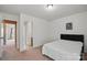 This bedroom has a doorway to another room and is a cozy place to sleep at 8923 Happiness Rd, Harrisburg, NC 28075