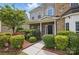 Charming entryway with a beautiful garden featuring vibrant flowers and lush greenery at 8923 Happiness Rd, Harrisburg, NC 28075