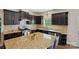 Gourmet kitchen with granite countertops, dark cabinetry, and stainless steel appliances at 8923 Happiness Rd, Harrisburg, NC 28075