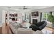Bright living room with fireplace and seamless flow to the kitchen at 8923 Happiness Rd, Harrisburg, NC 28075