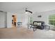 This living room has a couch and a window with plenty of space at 8923 Happiness Rd, Harrisburg, NC 28075