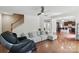 Open-concept living room with hardwood floors and seamless flow to other areas at 8923 Happiness Rd, Harrisburg, NC 28075