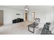 This living room has a keyboard, a couch, and lots of space at 8923 Happiness Rd, Harrisburg, NC 28075