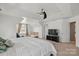 Main bedroom with plush carpet, high ceilings, and an arched window nook at 8923 Happiness Rd, Harrisburg, NC 28075